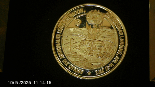 Silver-Round-With-An-Apollo-16-Motif--Design.